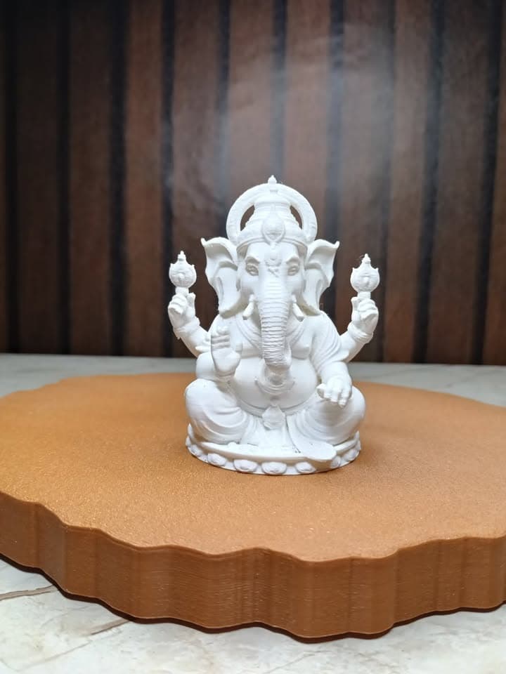 Front view of the detailed Ganesha idol on a bronze display plinth